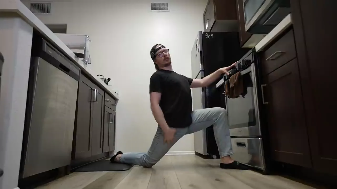Supported high hip-flexor lunge using a counter for balance